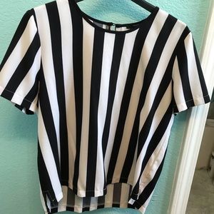 Blouse with black and white stripes.